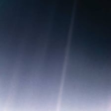 The famous photograph showing Earth as a tiny pale blue dot in space.