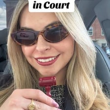 A lawyer presenting a motion before a judge.