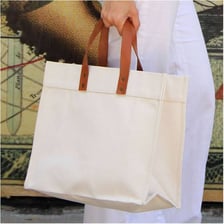 A reusable tote bag with two carrying handles.