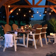A restaurant patio furnished with outdoor dining tables.