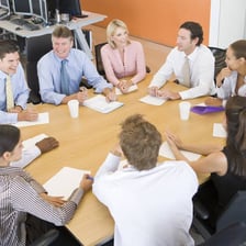 Parents and teachers gather for a meeting at a school.