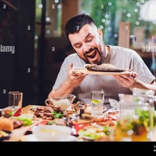 A person eating a meal at a table