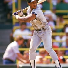 A baseball player standing in the batter’s box during an at-bat.