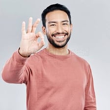 A person expressing enthusiastic agreement with a yes gesture.
