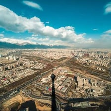 A view of an Iranian city and surrounding landscape.