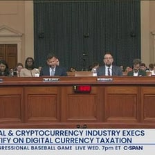 A congressional hearing being filmed for a C-SPAN broadcast.