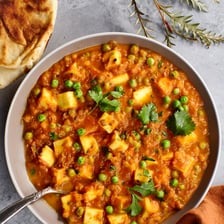 Matar paneer containing green peas and paneer cheese.
