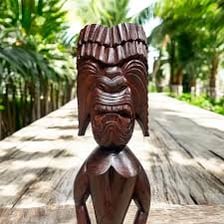 A carved Polynesian tiki figure.