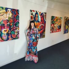 Drawings and paintings displayed at an art show