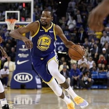 Kevin Durant playing basketball in an NBA game.