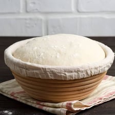 Yeast dough rising in a mixing bowl