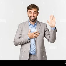 A person making a solemn promise with one hand raised.