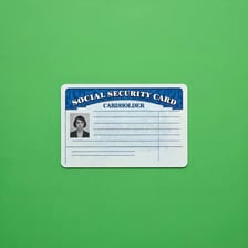 A Social Security card with identifying information obscured