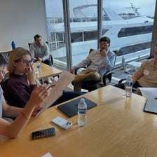 A professional agent discussing a contract at a meeting