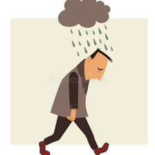 A person appearing embarrassed with their head lowered.