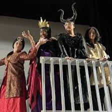 A performer entering a stage as an announcement concludes