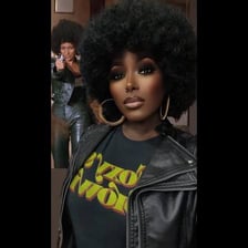 Pam Grier as Foxy Brown wearing a rounded Afro hairstyle