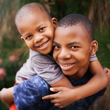 A brother and sister standing together