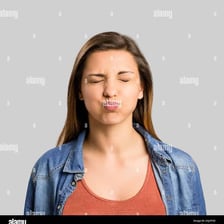 A person making a small displeased pout.