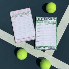 A tennis match scene illustrating the terms game, set, and match.