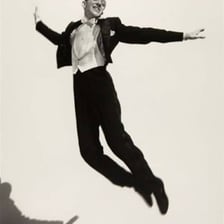 Fred Astaire performing a tap dance in tap shoes.