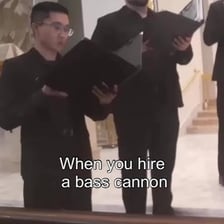 A group of male singers performing in a choir.