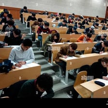Student completing an exam in a classroom