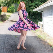 A person spinning around to display an outfit.