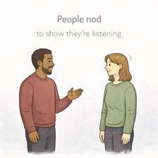 Two people in conversation, with one indicating understanding.