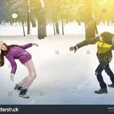 Children throwing snowballs outdoors