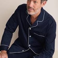 A person wearing elaborate pajamas with a luxurious appearance