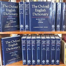 A multi-volume printed Oxford English Dictionary set.