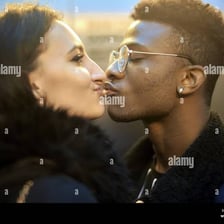 A couple kissing affectionately