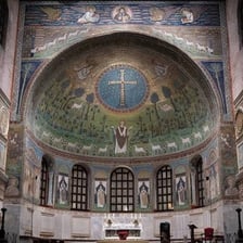 A church interior showing an apse behind an altar.