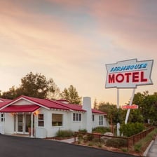 A roadside motel beside a highway