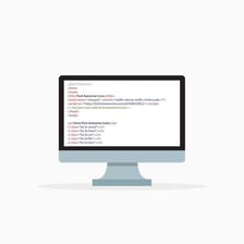 A computer screen showing CSS code beside a styled web page.