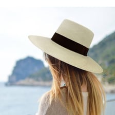 A traditional broad-brimmed straw Panama hat.