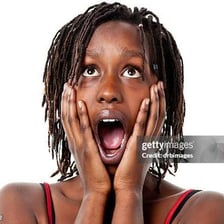 A person visibly inhaling sharply in surprise
