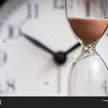 A clock and hourglass representing the passage of time