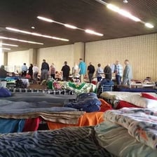 People entering a building that provides residential shelter.