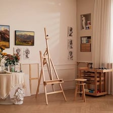 An easel supporting a canvas in an art studio.