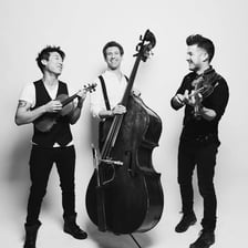 Three musicians performing together as a small ensemble.