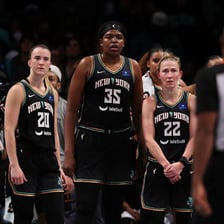 New York Liberty players competing in a WNBA basketball game
