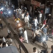 A crowd gathered in a noisy commotion