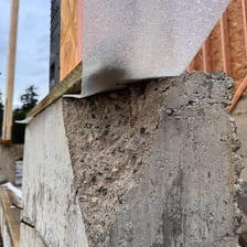 A construction project with visibly incomplete or poorly finished work.