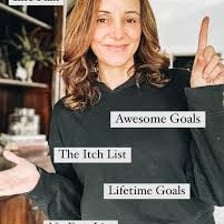 Person marking a goal on a bucket list