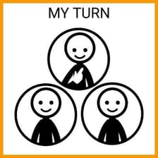 People arranged in a circle, taking turns at an activity.