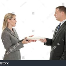 One person handing an object to another person.
