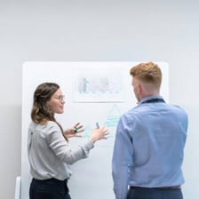 Two people in conversation as one clarifies a statement