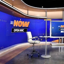 A television news broadcast being filmed in a studio.